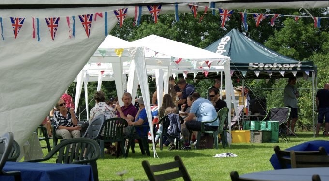 People relax at the festival sitting on chairs